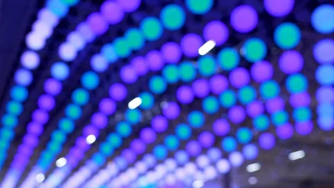 Beautiful colored glowing and moving balls and garlands on the ceiling at holida Stock Footage 121114451