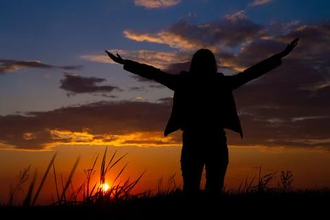 Beautiful colored sky and thick clouds at sunset on the horizon silhouette .. Stock Photos