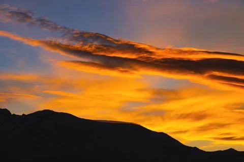 Beautiful colorful dramatic sky with clouds at sunset or sunrise Stock Photos