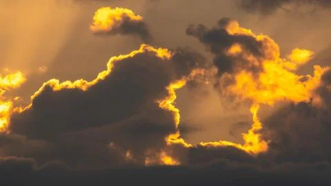 Beautiful colorful dramatic sky with clouds at sunset or sunrise. Stock Photos