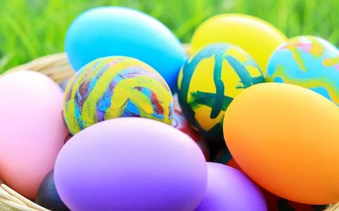 Beautiful colorful Easter eggs in a basket for Easter day Stock Photos
