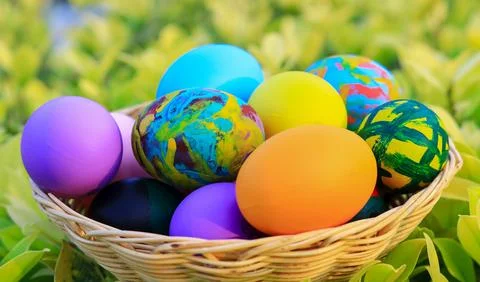 Beautiful colorful Easter eggs in a basket for Easter day Stock Photos