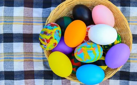 Beautiful colorful Easter eggs in a basket for Easter day Stock Photos