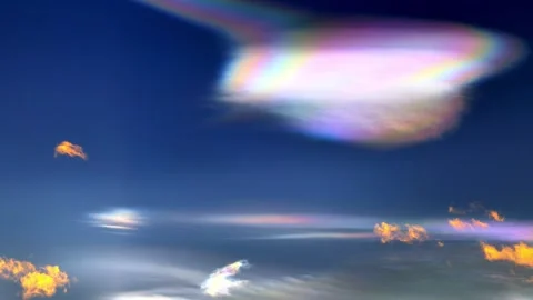 Beautiful Colorful Rainbow Clouds (Cloud Iridescence) Against Blue Sky Stock Footage 264756224