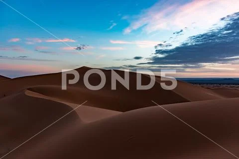 Beautiful colorful sunset in Erg Chebbi Dunes, Sahara Desert, Merzouga, Moroc Stock Photos