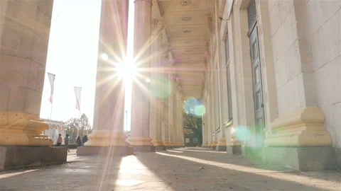 Beautiful columns. Camera in motion. High building. Sun rays. Slow motion Stock Footage 103420385