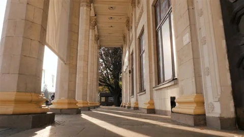 Beautiful columns. Camera in motion. High building. Sun rays. Slow motion Stock-Footage 103420603