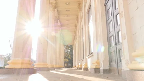 Beautiful columns. High building. Slow motion. Camera in motion. Sun rays Stock Footage 103420244