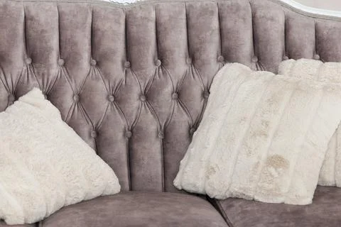 Beautiful, comfortable grey sofa with soft, light grey cushions, forms part.. Stock Photos