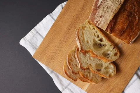 A Beautiful Composition of Artisan Bread Slices Presented on a Dark Background Stock Photos