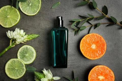 Beautiful composition with bottle of perfume on grey background, flat lay 写真素材