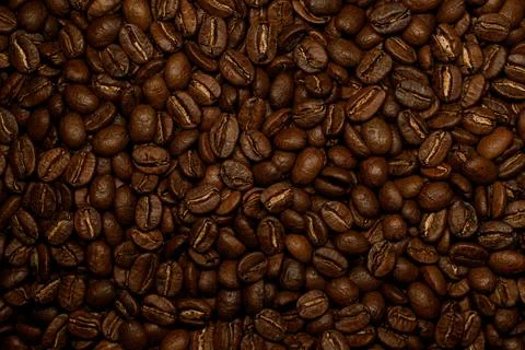 Beautiful composition of brown roasted coffee beans. Can be used as background. Stock Photos