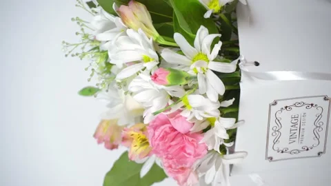Beautiful composition of delicate flowers rotation on the turntable. Stock Footage 176928548