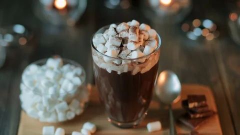 Beautiful composition - hot chocolate with marmalade and chocolate pieces in a Stock Footage