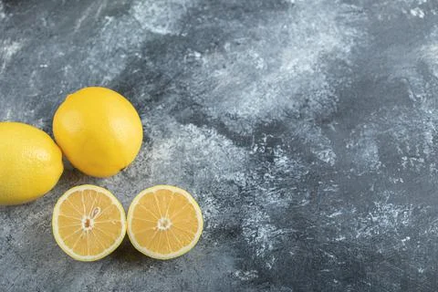 Beautiful composition with lemons .Half cut and whole Stock Photos
