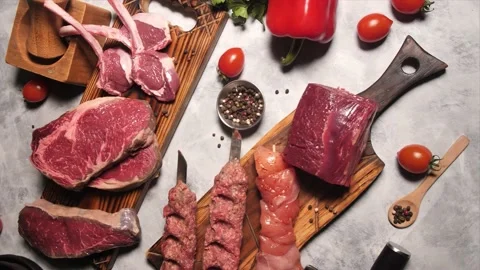 Beautiful composition of raw meat and vegetables on a dark wooden background. 動画素材 239302106
