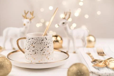Beautiful composition with white Cup with the gold new year's drink Stock Photos