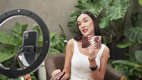 Beautiful content creator making natural beauty and cosmetic tutorial. Blithe Video stock 275949418