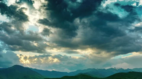 Beautiful countryside clouds dramatic cloudy sky mountains peaks timelapse Stock Footage