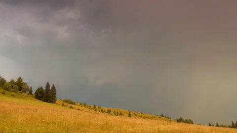 Beautiful countryside scenery with dramatic cloudy sky and mountains range Stock Footage 87906676