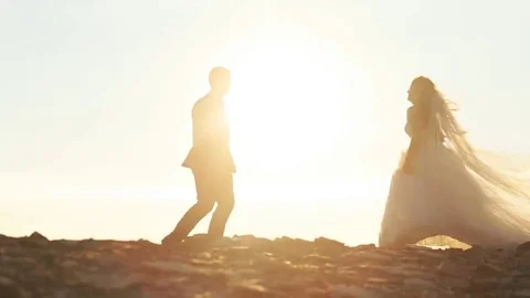 Beautiful couple approaching to each other in the hill of the mountain Stock Footage 69148513