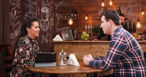 Beautiful couple choosing from menu from digital tablet Stock Footage 101241500