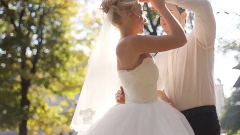 Beautiful couple dancing on the garden , looking on each others eyes and being Stock Footage 73925576