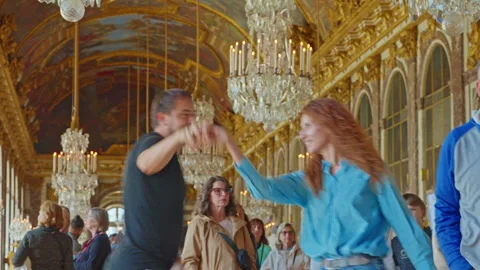 Beautiful couple dancing in Hall of Mirror Royal Palace of Versailles Stock Footage 314445800