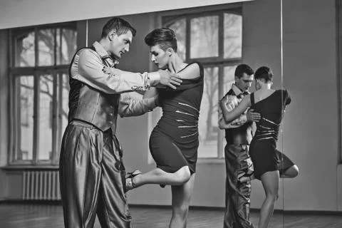 Beautiful couple dancing tango Stock Photos