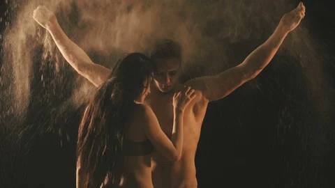 Beautiful couple in flour particles Stock Footage 105885012