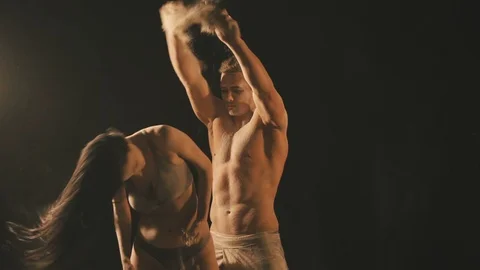 Beautiful couple in flour particles Video stock 106787778
