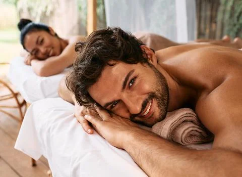Beautiful couple getting a back massage on Bali resort, romantic weekend an.. Photos