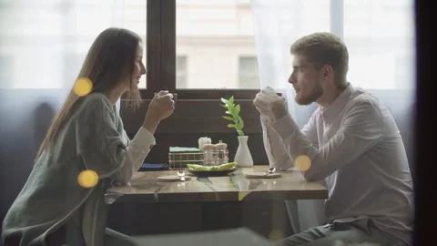 Beautiful couple having coffee on a date,having fun together Stock Footage 111246590