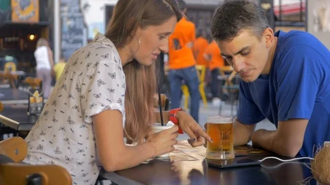 Beautiful couple having drinks on a date Stock Footage 106475646
