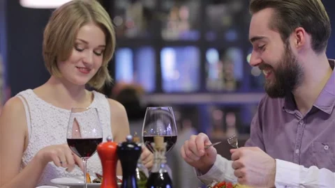Beautiful couple having romantic dinner at restaurant Stock Footage 252597953