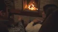 The beautiful couple holding hands by the fireplace 4k or 4k+ Resolution