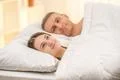 The beautiful couple lie on the bed Photo