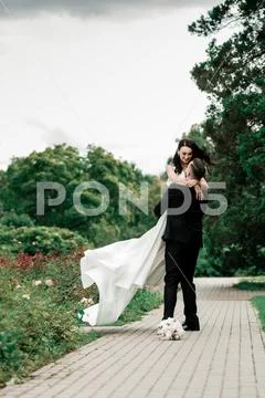 Beautiful couple in love on the blurred background of the city Park Stock Photos