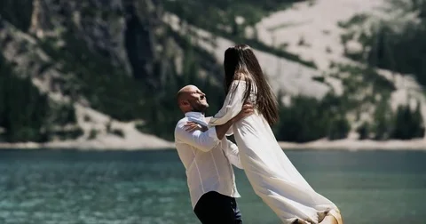 Beautiful couple in love playing elements of dance in the middle of the forest Stock Footage 83378692