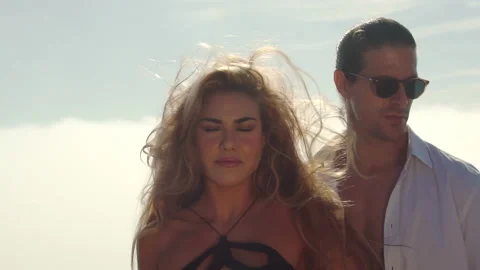 Beautiful couple of lovers on the background of clouds. The relation Stock Footage 166876490