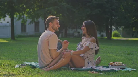 Beautiful couple on a picnic and love each other Stock Footage 156477458