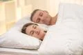 The beautiful couple sleeping on the bed Photo