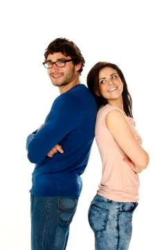 Beautiful couple stood back to back isolated on a white background Stockfoto's