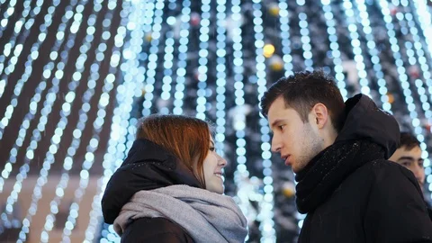Beautiful couple under the snowfall, New Year Christmas concept Stock Footage 100609692