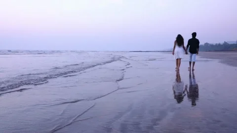 Beautiful Couple Walking on Beach Stock Footage 160822739