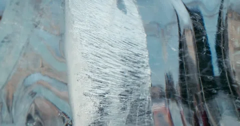 Beautiful crack in the ice transparent block Stock Footage 256454052