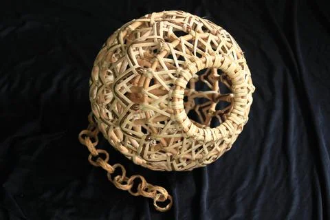 Beautiful crafted lantern hood made of natural rattan Stock Photos