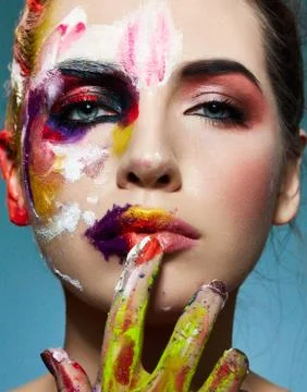 Beautiful creatively colored model looking at camera Stock Photos