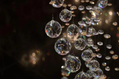 Beautiful crystal balls hanging on fine threads beautifully reflect Stock Photos