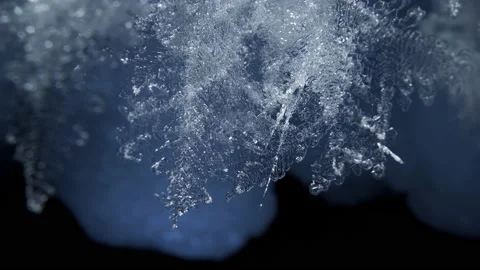 Beautiful crystal icicles, blue sharp ice snowflakes on stalactites inside cave Stock Footage 180324980